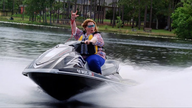 She is not demonstrating proper jet ski safety.